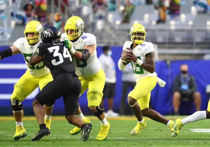 Brown sits in the pocket against Iowa State with Alex Forsyth and Ryan Walk pass protection.